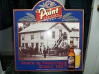A Stevens Point Brewery tin sign.
